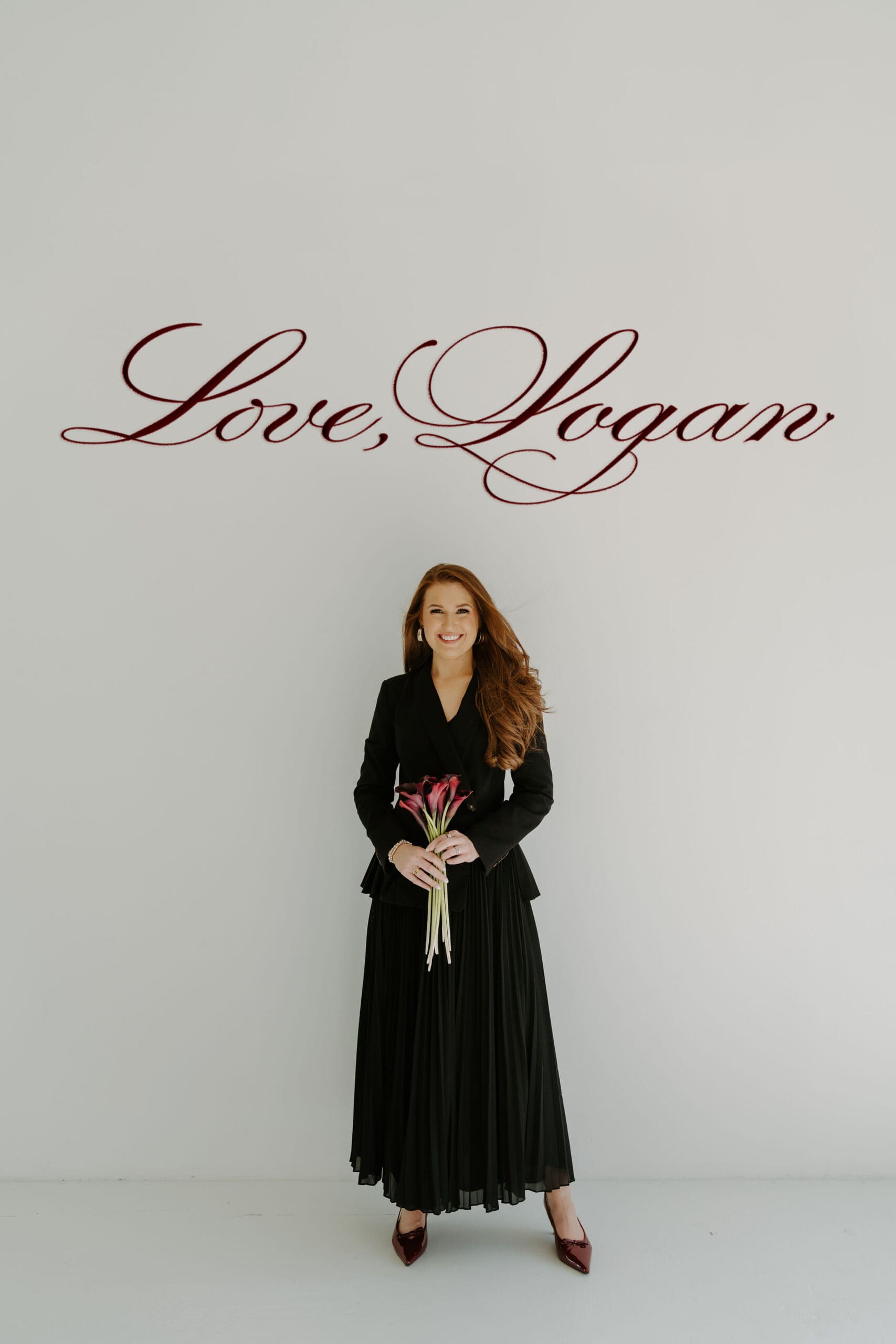 wedding content creator holding flowers with logo above saying love logan in cursive
